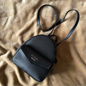 Sleek black Guess backpack/crossbody